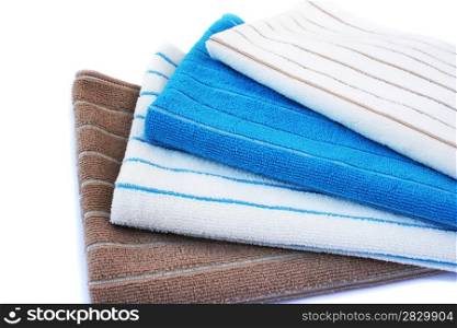 Colorful towels isolated on white background.