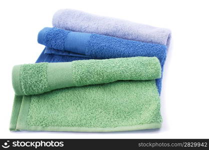 Colorful towels isolated on white background.