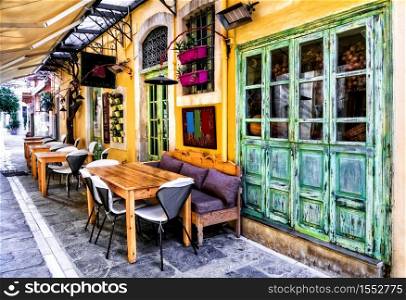 Colorful traditional Greece series - small street restaurants in old town of Rethymno, Crete island. traditional tavern in narrow streets of old town Rethymno, Crete island