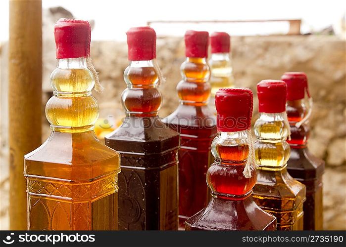 colorful traditional liquor bottles in rows arrangement