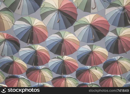 colorful umbrellas float in the air