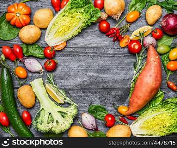 Colorful various of organic farm vegetables on light blue wooden background, top view. Healthy foods, cooking and vegetarian concept.