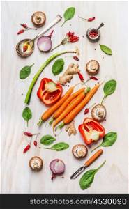 Colorful vegetables ingredients for healthy cooking. Composing on white wooden background. Vegan nutrition and diet food concept. Top view