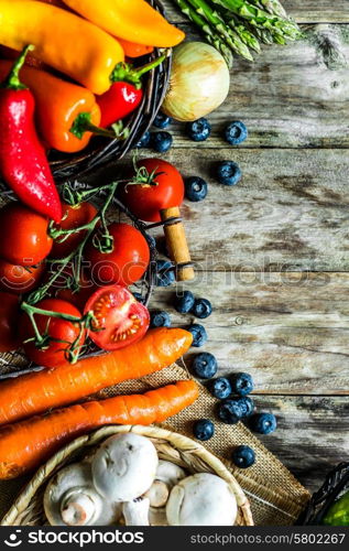Colorful vegetables on wooden background