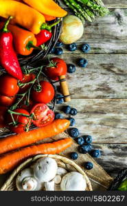 Colorful vegetables on wooden background