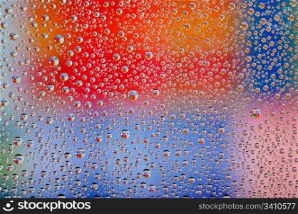 Colorful waterdrops. Colorful abstract wallpaper, waterdrops over multicolor background
