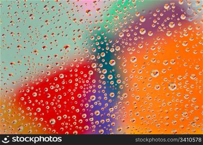 Colorful waterdrops. Colorful abstract wallpaper, waterdrops over multicolor background