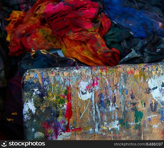 Colorful wood board and dirty fabrics of printing. Colorful wood board and dirty fabrics in a printing factory at the cleaning area