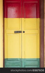 colorful wood doors recycle with new paint over old paint.