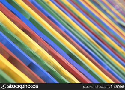Colorful wood fence. Painted sticks background