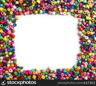 Colorful wooden beads frame on white background