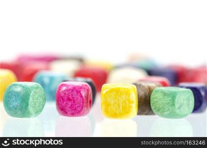 Colorful wooden beads isolated on white background