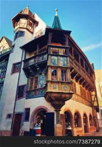 Colorful wooden building facade in Colmar city, France, Alsace. Historic town traditional house. Medieval architecture.
