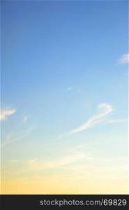 Colorful yellow blue sky, may be used as background. Vertical composition