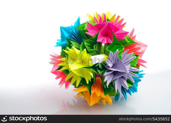 Colorfull origami kusudama from rainbow flowers isolated on white.