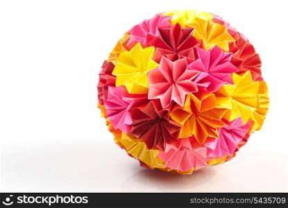 Colorfull origami kusudama from rainbow flowers isolated on white