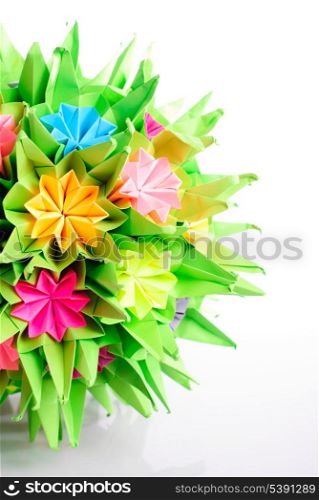 Colorfull origami kusudama from rainbow flowers isolated on white. View from four angles.