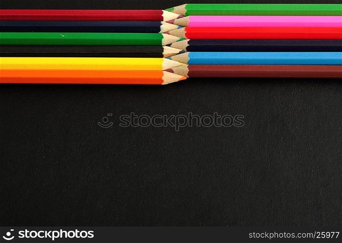 Coloring pencils isolated on a black background