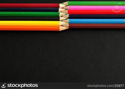 Coloring pencils isolated on a black background