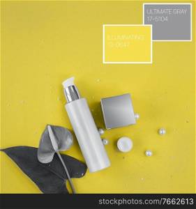 Colors of the year 2021  Ultimate Gray and Illuminating yellow concept. Makeup cosmetic products, flat lay, top view.. Colors of the year 2021  Ultimate Gray and Illuminating yellow concept