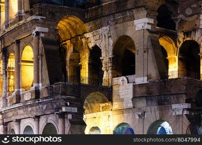 Colosseum exterior night view. Symbol of Imperial Rome, Italy.