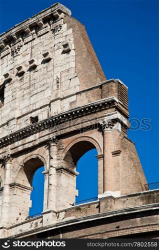 Colosseum in Rome with blue sky, landmark of the city