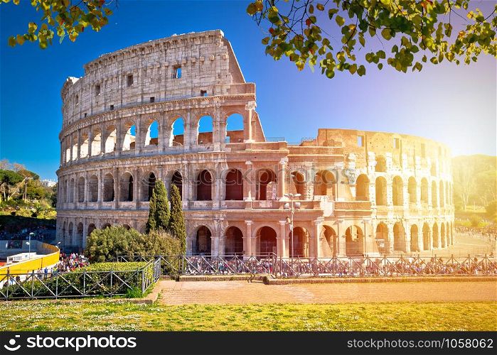 Colosseum of Rome scenic sun haze view, famous landmark of eternal city, capital of Italy