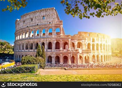 Colosseum of Rome scenic sun haze view, famous landmark of eternal city, capital of Italy