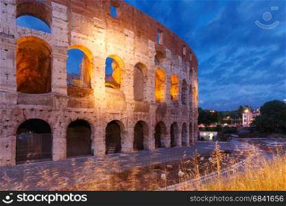 Colosseum or Coliseum at night, Rome, Italy.. Colosseum or Coliseum at night, also known as the Flavian Amphitheatre, the largest amphitheatre ever built, in the centre of the old city of Rome, Italy.