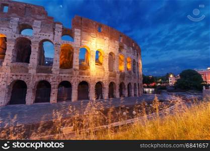 Colosseum or Coliseum at night, Rome, Italy.. Colosseum or Coliseum at night, also known as the Flavian Amphitheatre, the largest amphitheatre ever built, in the centre of the old city of Rome, Italy.