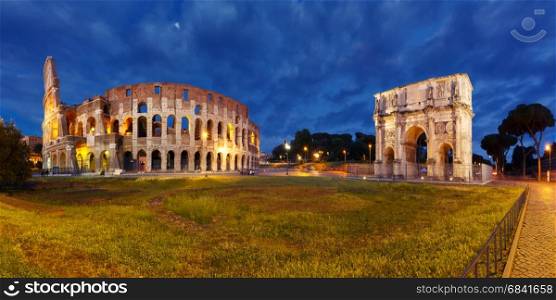 Colosseum or Coliseum at night, Rome, Italy.. Panorama of The Arch of Titus and Colosseum or Coliseum at night, also known as the Flavian Amphitheatre, the largest amphitheatre ever built, in the centre of the old city of Rome, Italy.