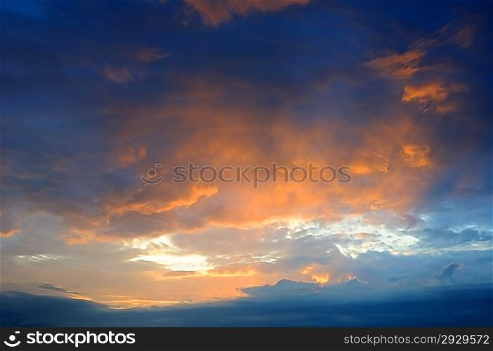 Colour clouds on the blue sky at sunset