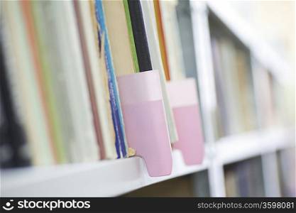 Colour coded filing system on library shelves