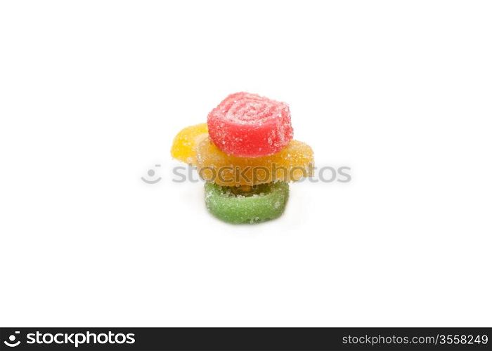 Colour fruit jellies in sugar on white background