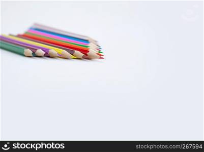 Colour pencils isolated on white background with selective focus with copy sapce. Back to school, Drawing concepts. Closeup.