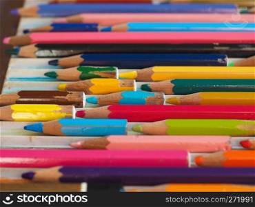 colour pencils of many different colors and length. many colour pencils