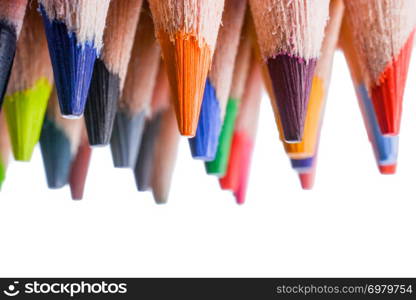 Colour pencils of various colors on white background