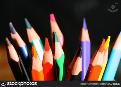 colour pencils on black macro close up