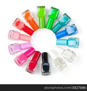 Coloured nail polish bottles stacked circle on a white background.With clipping path