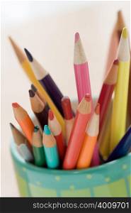 Coloured pencils in a pot