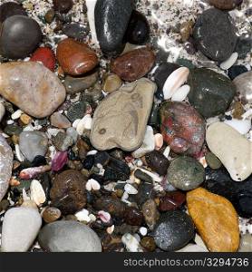 Coloured stones and pebbles along the shoreline in Costa Rica