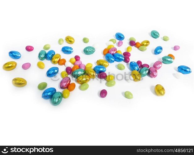 Coloured sugar eggs on white background.. Coloured sugar eggs on white background