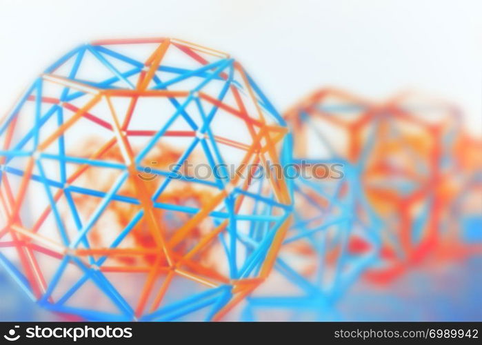 Coloured three-dimensional model of geometric solids closeup defocused - abstract blurred background.. Abstract Geometric Blurred Background