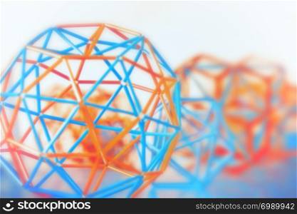 Coloured three-dimensional model of geometric solids closeup defocused - abstract blurred background.. Abstract Geometric Blurred Background