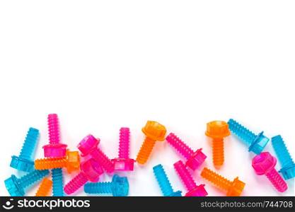 Coloured translucent toy bolts isolated on white background. Flat lay. Concept of World Dad?s Day, unisex toys for early development, role-playing games. Layout for social media, for toy stores.
