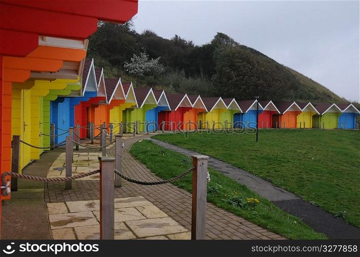 Colourful beach huts.