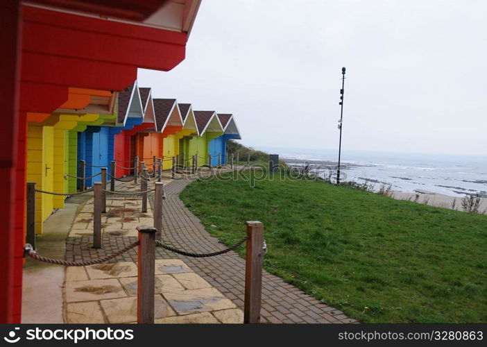 Colourful beach huts.