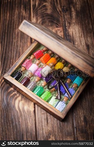 colourful beads in mini retro glass bottles. Handmade set in box. colourful beads