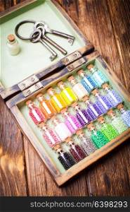 colourful beads in mini retro glass bottles. Handmade set in box. The colourful beads