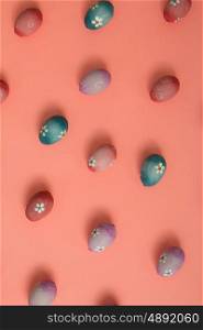 Colourful Easter Eggs ordered on a pink background